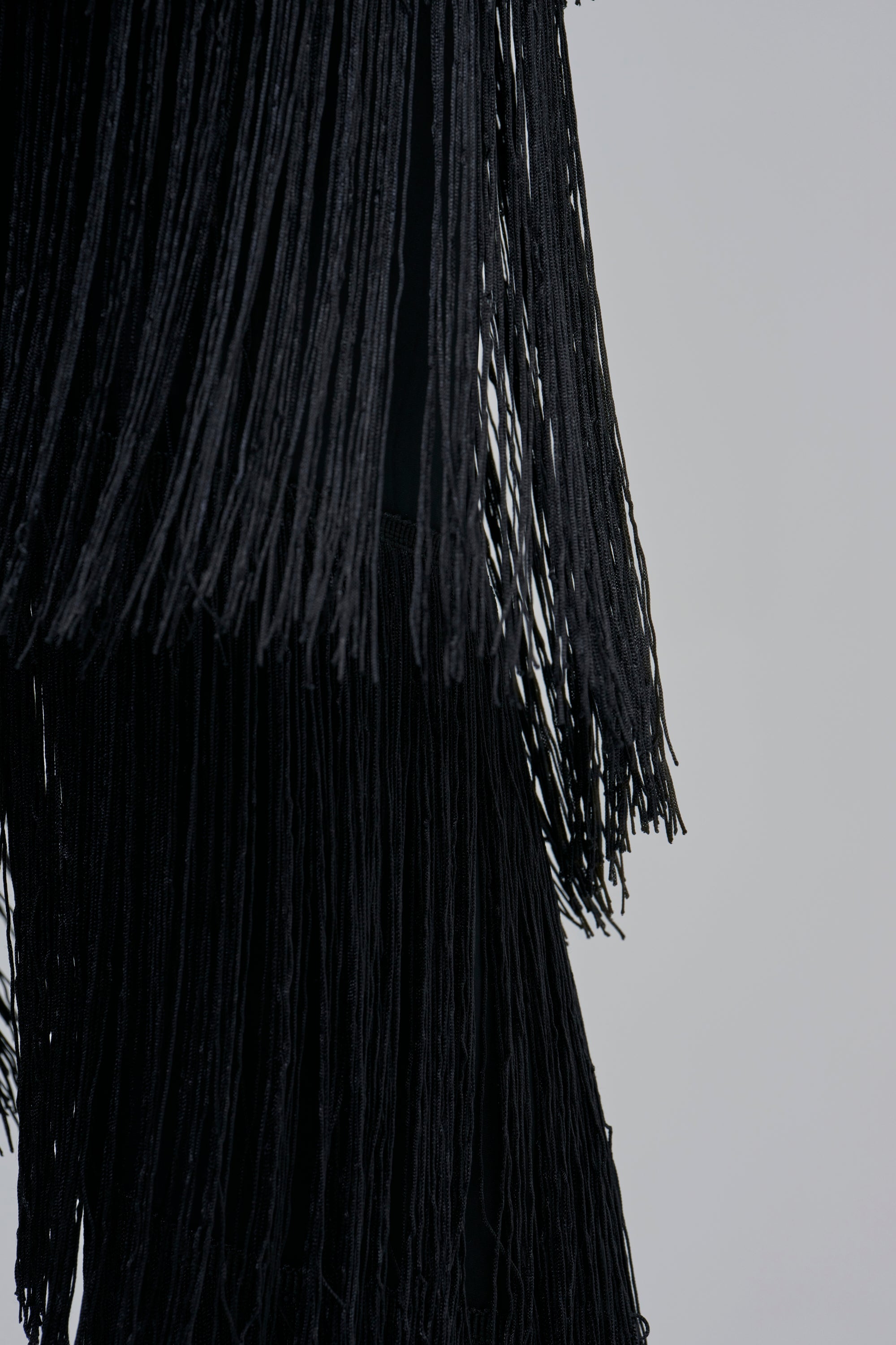 BAECATION FRINGE JUMPSUIT IN BLACK